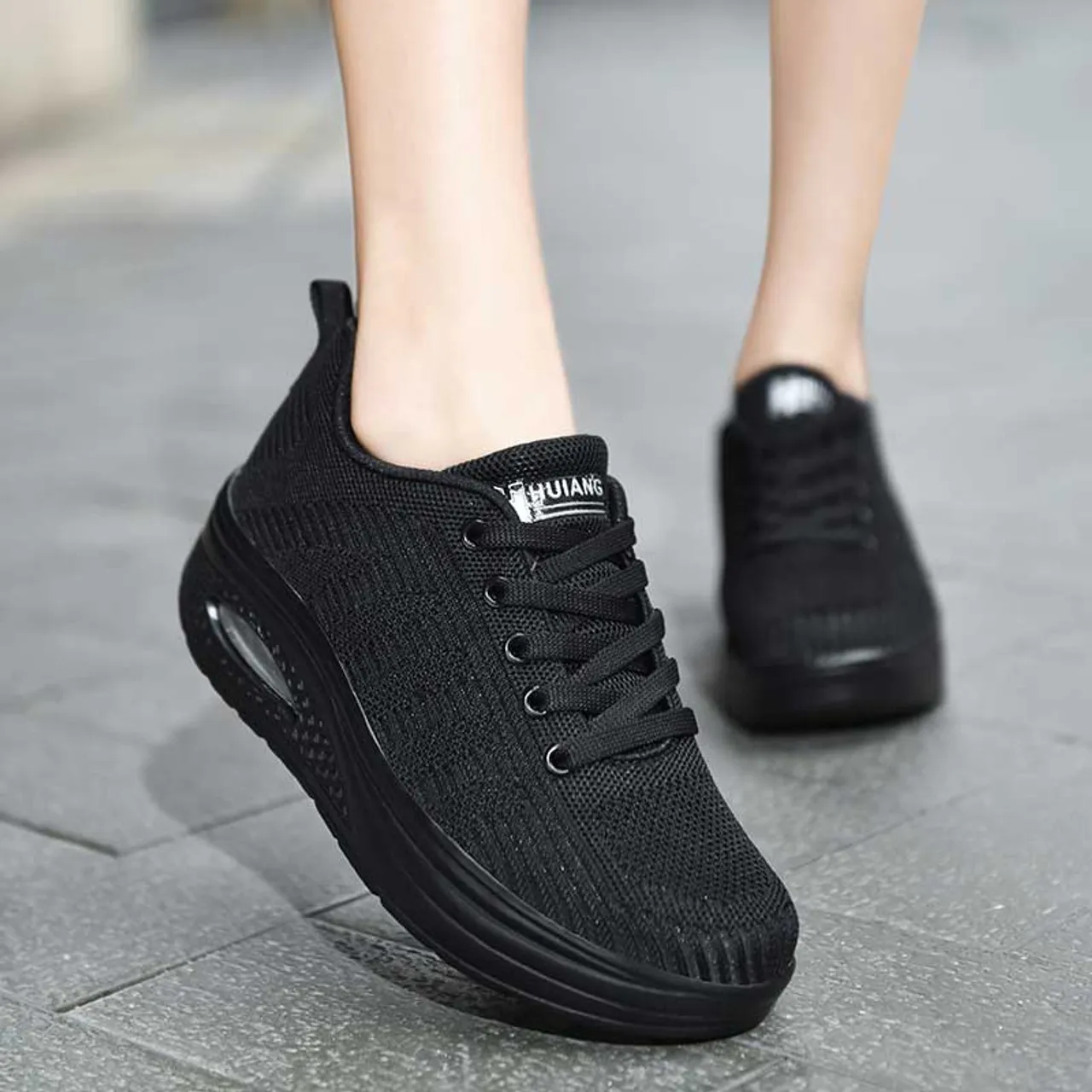 Black flyknit stripe texture rocker bottom shoe sneaker