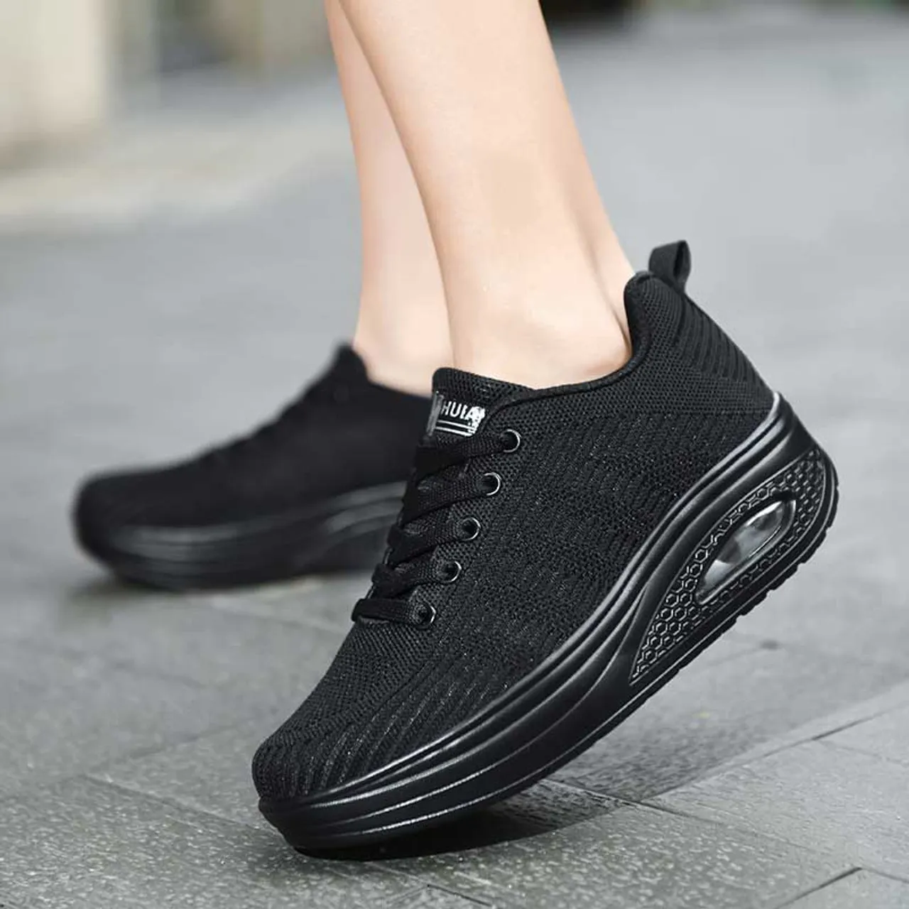 Black flyknit stripe texture rocker bottom shoe sneaker