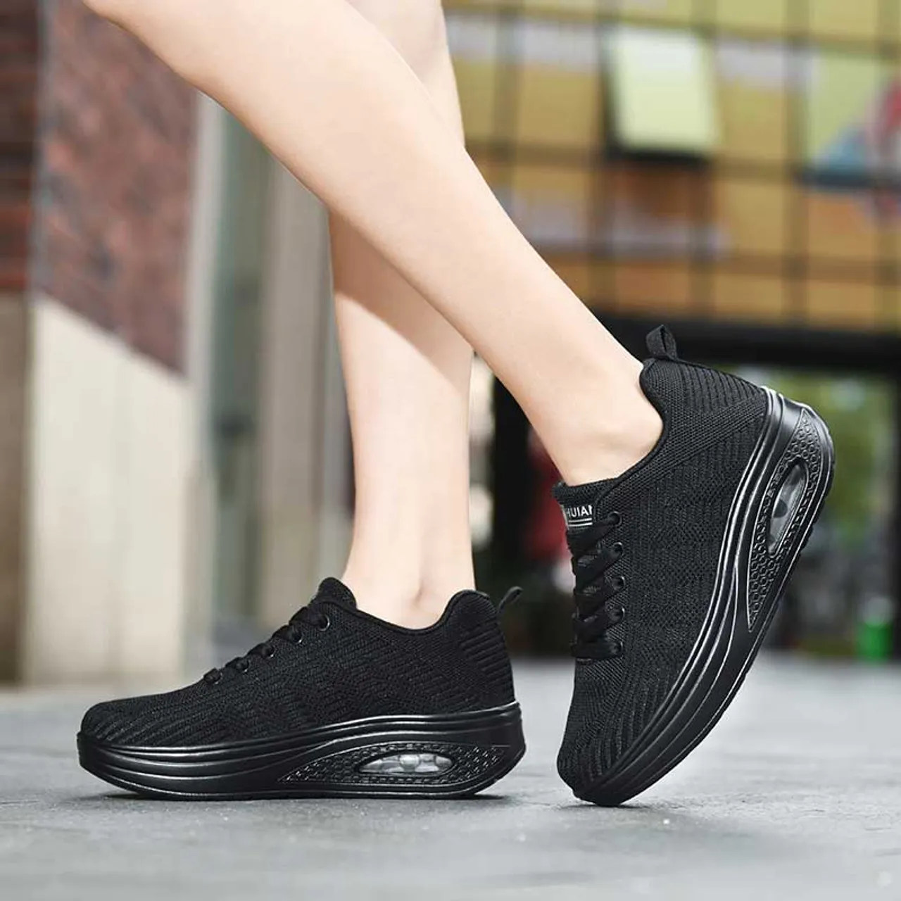 Black flyknit stripe texture rocker bottom shoe sneaker