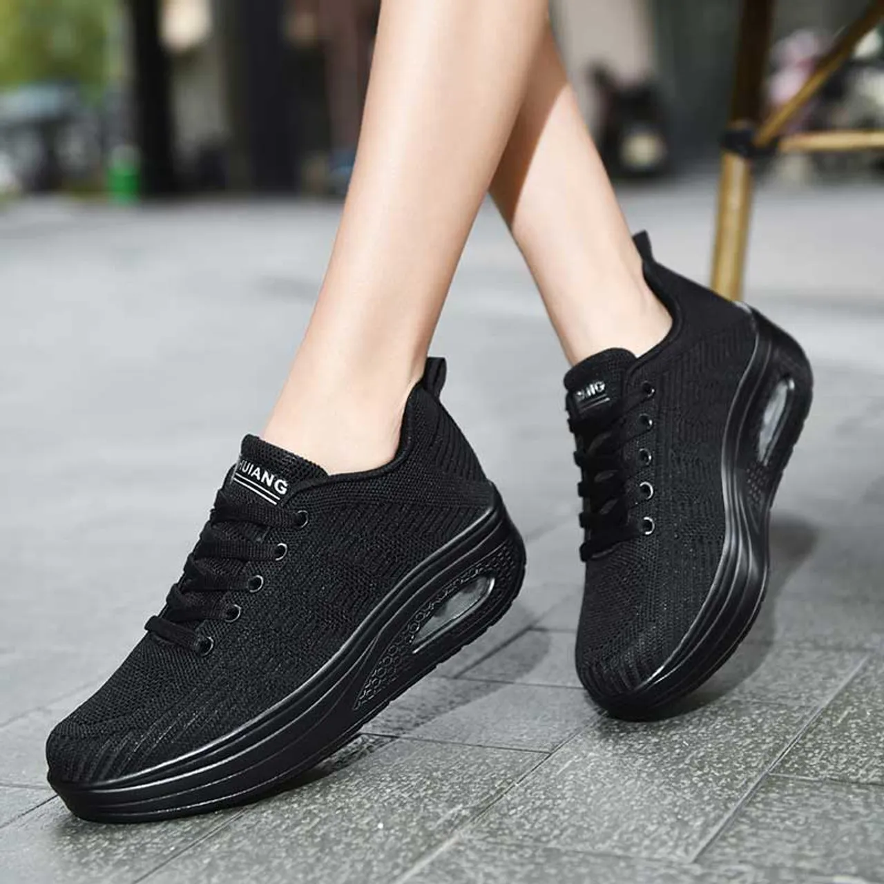 Black flyknit stripe texture rocker bottom shoe sneaker